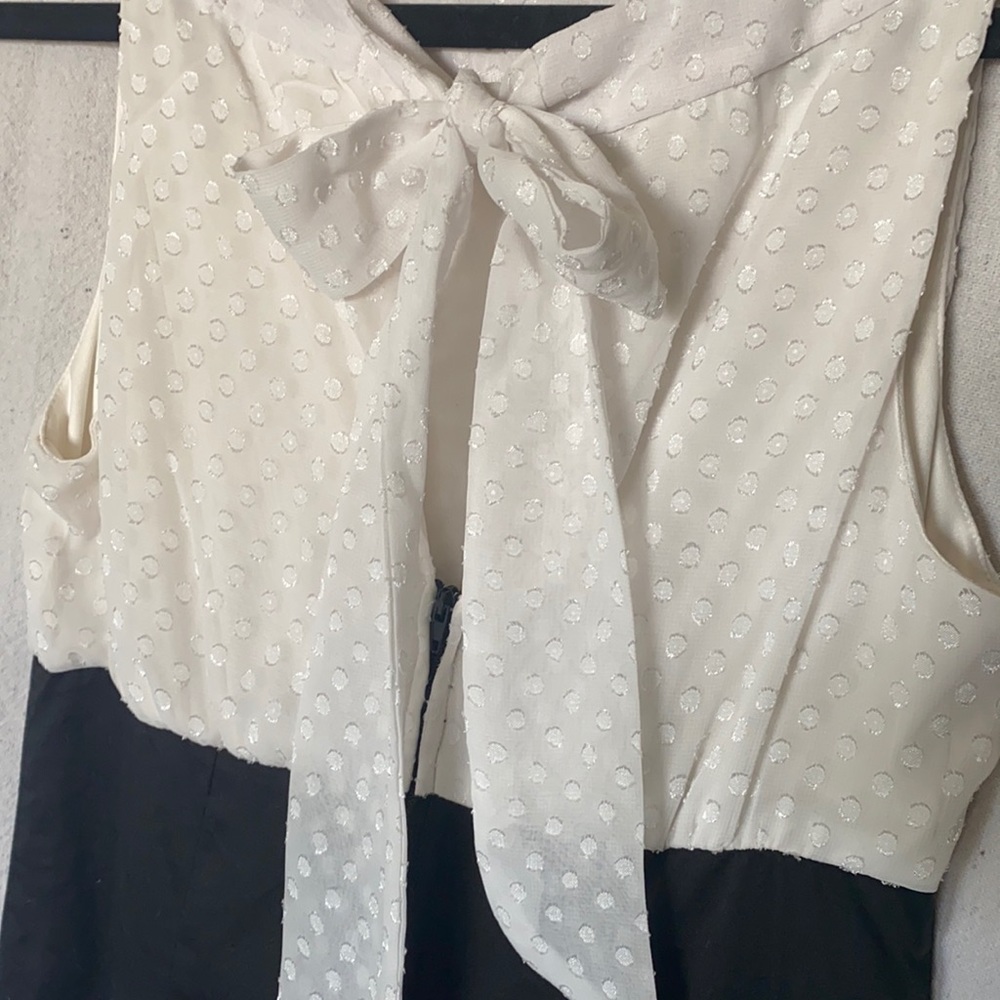 Dress with dot white pattern and back bow tie